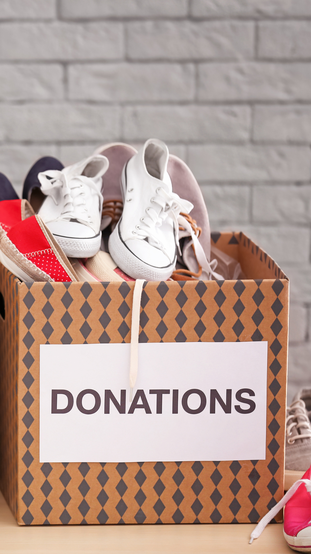 Image of shoes in a box that says "donations"