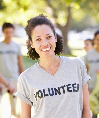 woman wearing a shirt that says "volunteer"